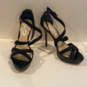 Like new worn once for a wedding stunning size 9 black heels.